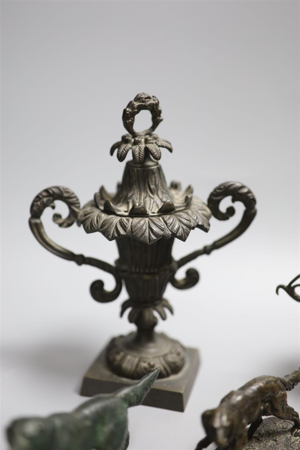 A collection of bronze and metal animals, sun dial and lidded urns etc